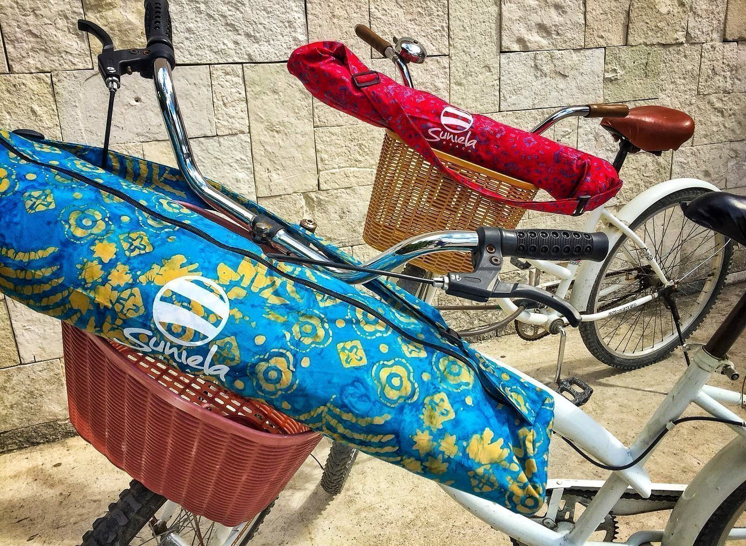 Colourful portable shade cabanas resting across bike baskets
