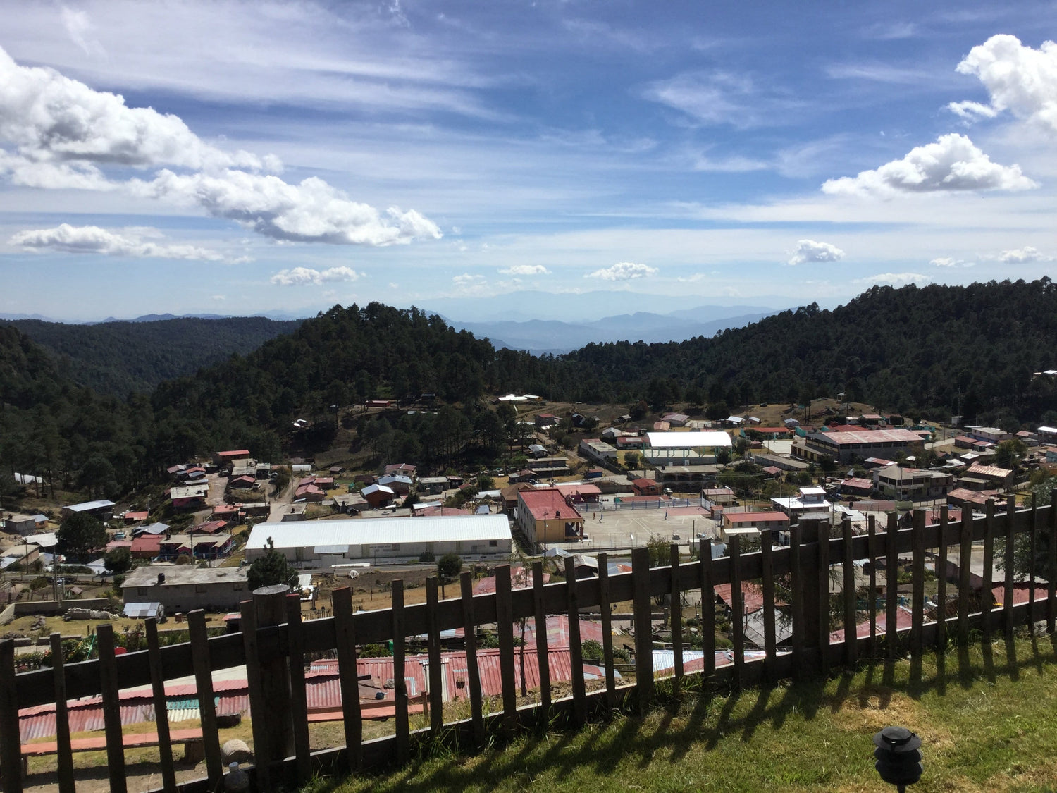 Town view with mountains in the distance and blue sky, in the state of Oaxaca, Mexico