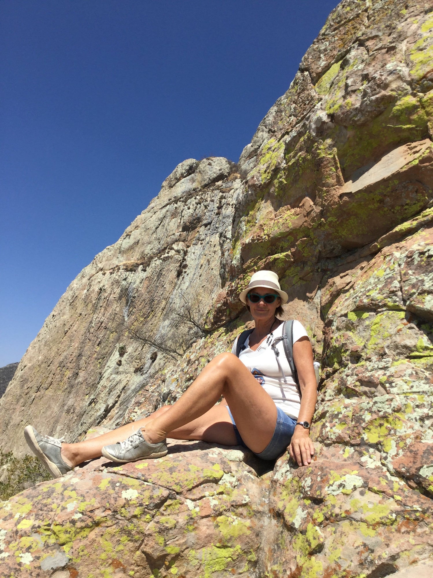 Woman sits on a large rocky ground in Queretaro, Mexico