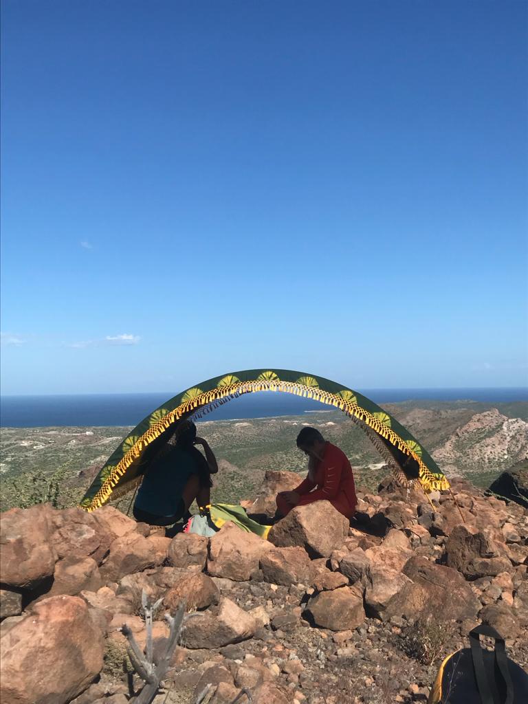 suniela travel shade tent on top of a rocky mountain 