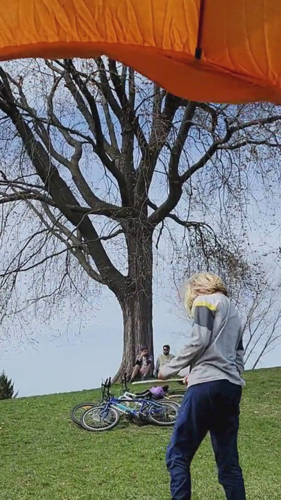kid plays paddleball game in the park