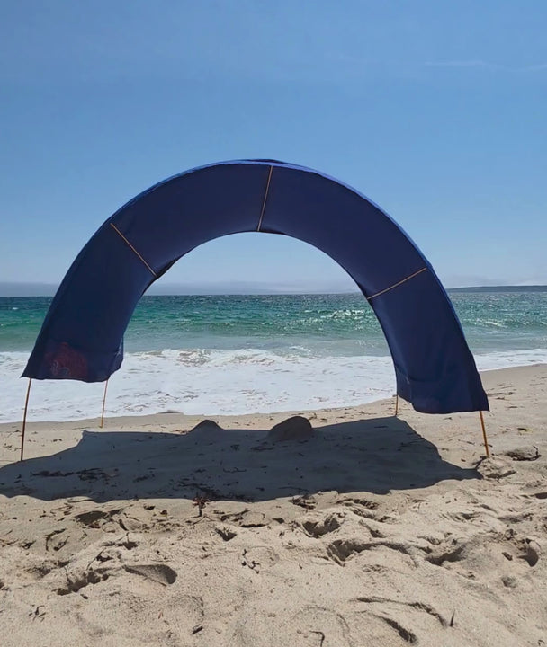 video showing an arched suniela beach tent withstanding strong coastal winds