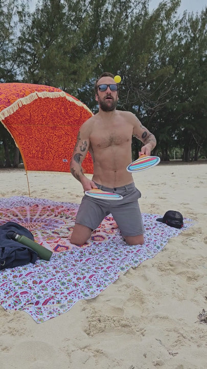 playing Suniela beach paddleball game solo in Bahamas